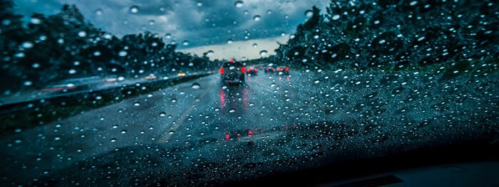 cars driving in the rain