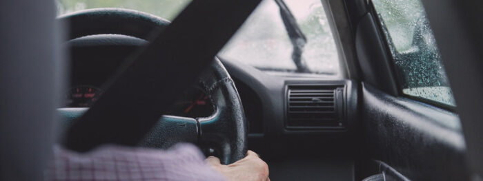 man long distance driving in the rain