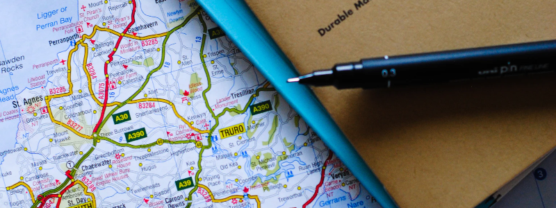 map with a notebook and pen
