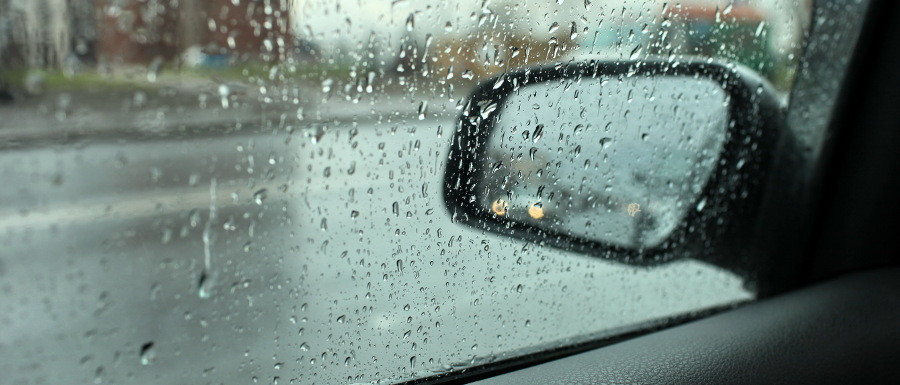 side mirror being used when driving in the rain
