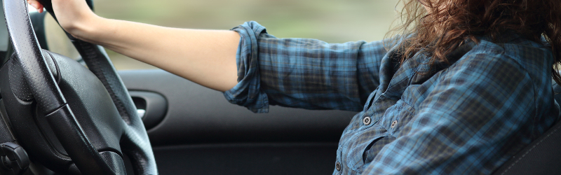 woman carefully driving her car to get better fuel economy