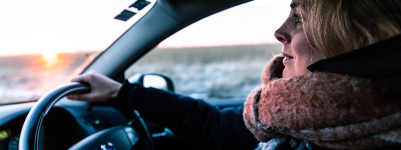 woman in her car suffering from driver fatigue