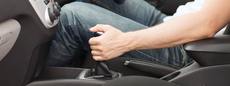 man driving uphill and using his gears carefully