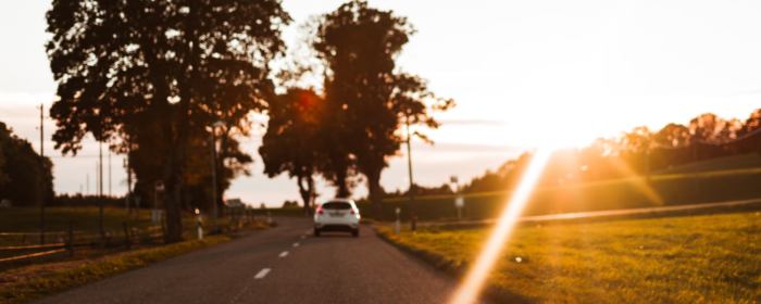 car driving on a sunny road