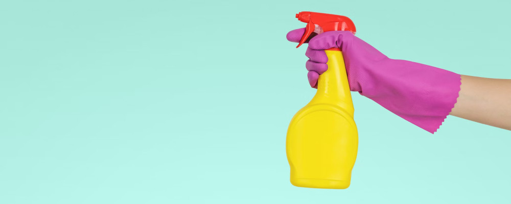 cleaning product in a gloved hand
