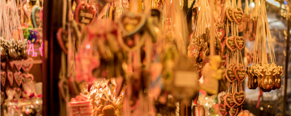 hanging christmas decorations on a market stall