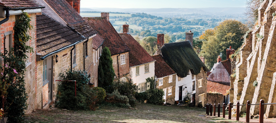 beautiful old village that curves downward with scenic views of the countryside in background
